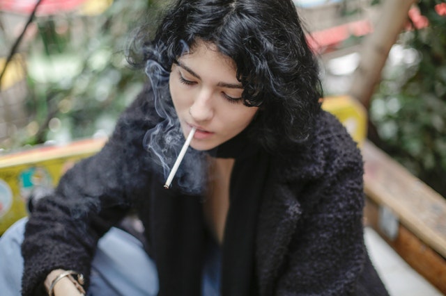 photo-of-woman-smoking-cigarette-3916481